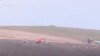 Armenia - Azerbaijani troops dig trenches outside Tegh village.