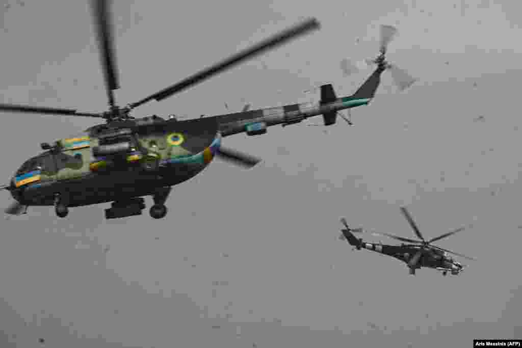 Ukrainian Mi-8 and Mi-24 helicopters take off for a mission against Russian targets. 