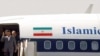 Iran - Iranian President Mahmud Ahmadinejad leaves the plane upon arrival in Algiers, 06Aug2007