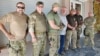 Європарламентар Яромір Штєтіна на зустрічі з бійцями батальйону «Азов». (Зліва направо) Доброволець з Грузії «Заза», колишній міністр юстиції Роман Зварич, командир батальйону «Азов» поряд з європарламентарем (Фото: Petra Procházková)