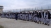 Newly freed Taliban prisoners line up at Bagram prison, north of Kabul, Afghanistan April 11, 2020. Picture taken April 11, 2020. 