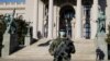 SERBIA -- A Serbian army soldier patrols in front of the parliament building as the number of coronavirus disease (COVID-19) cases grow around the world, in Belgrade, March 16, 2020