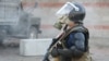KYRGYZSTAN - A member of Kyrgyz state security forces takes part in a raid to detain former President Almazbek Atambayev, who was accused of corruption, in the village of Koi Tash near Bishkek, Kyrgyzstan August 8, 2019