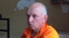 Заключенный лидер оппозиции Владимир Козлов беседует в тюрьме с правозащитниками. 21 июля 2015 года. 