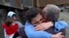 Armenia - Ethnic Armenians who fled Nagorno-Karabakh embrace upon their arrival in the Armenian border village of Kornidzor, September 26, 2023. 