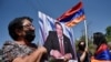 ARMENIA -- A supporter of Armenian opposition leader Gagik Tsarukian holds its portrait during a unauthorized rally close to National Secuirury Service headquarter in Yerevan, June 14, 2020